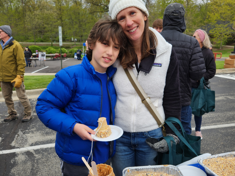 Mom and son making bird feeder at JCC Earth Day
